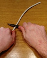 OneCup OneLife - Cutting the plastic around the wires with a knife 1.jpg